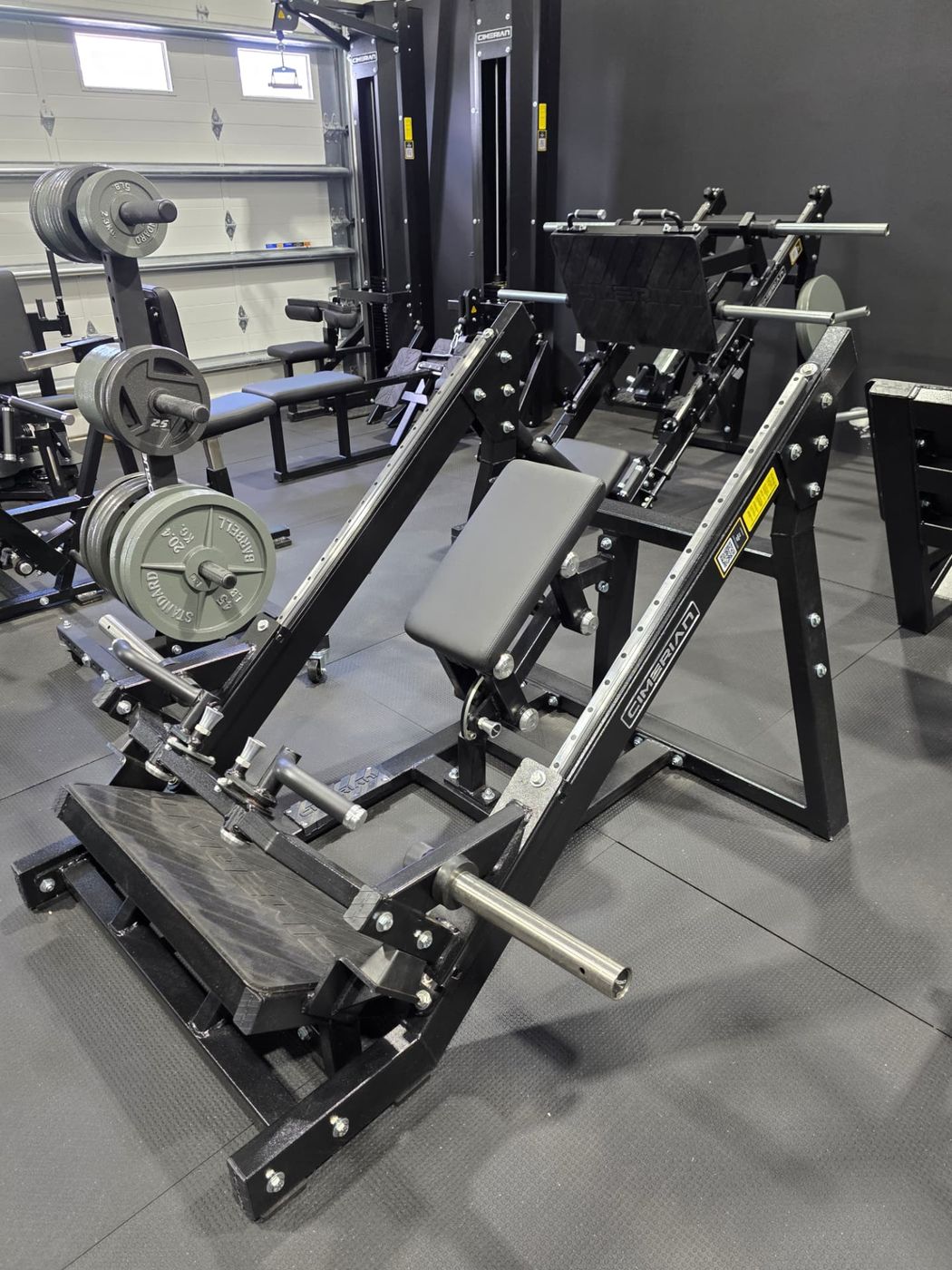 Leg press and hack squat machines in the private gym