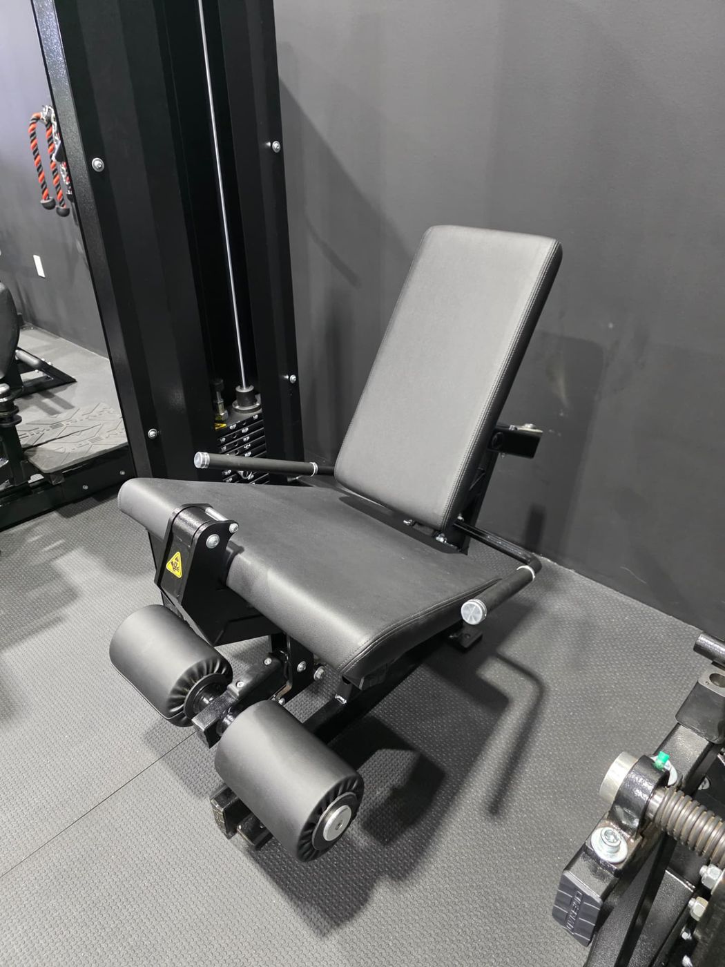 Leg extension and curl station in the private gym